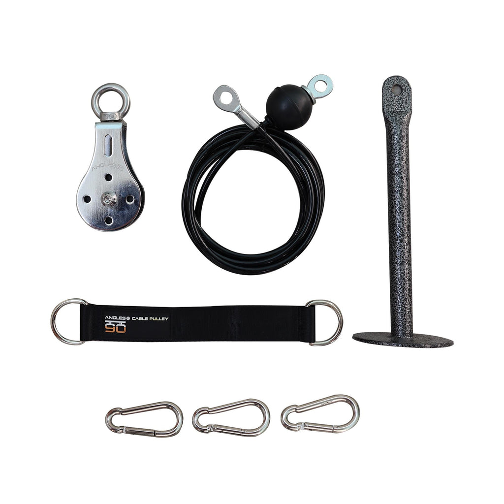 Climbing and rigging equipment arranged neatly against a white background, including an A90 Cable Pulley, heavy-duty steel cable, strap, piton, and carabiners.